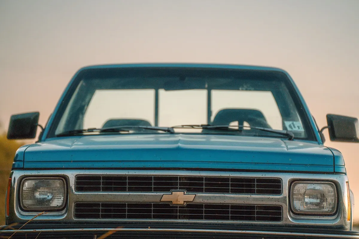 Front view of an older Chevrolet pickup truck with the bowtie badge