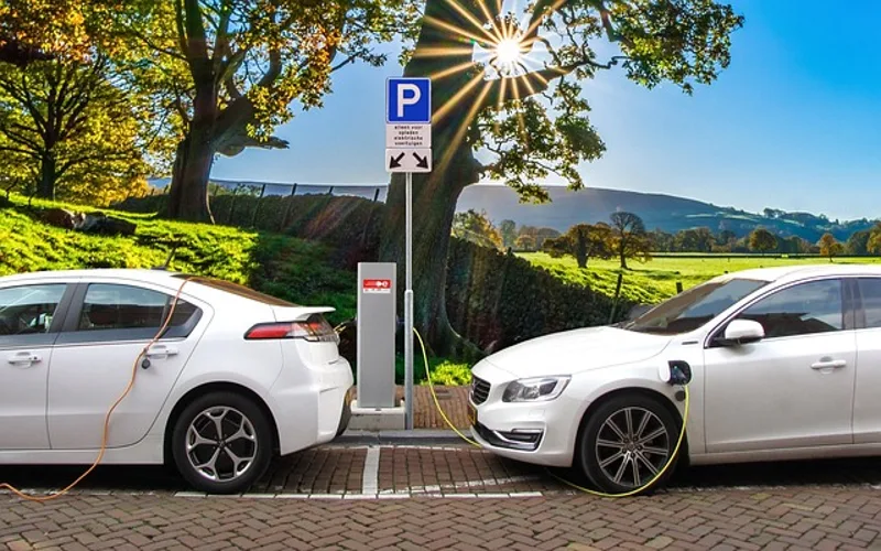Hybrid car at a charging station, an example of a fuel-efficient vehicle
