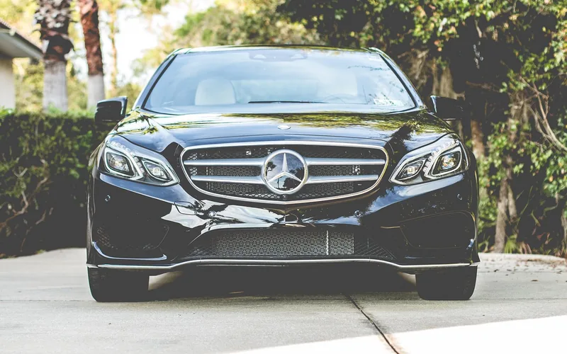 A dark luxury sedan parked outdoors, the type of vehicle Nissan builds under its Infiniti brand A dark luxury sedan parked outdoors, the type of vehicle Nissan builds under its Infiniti brand