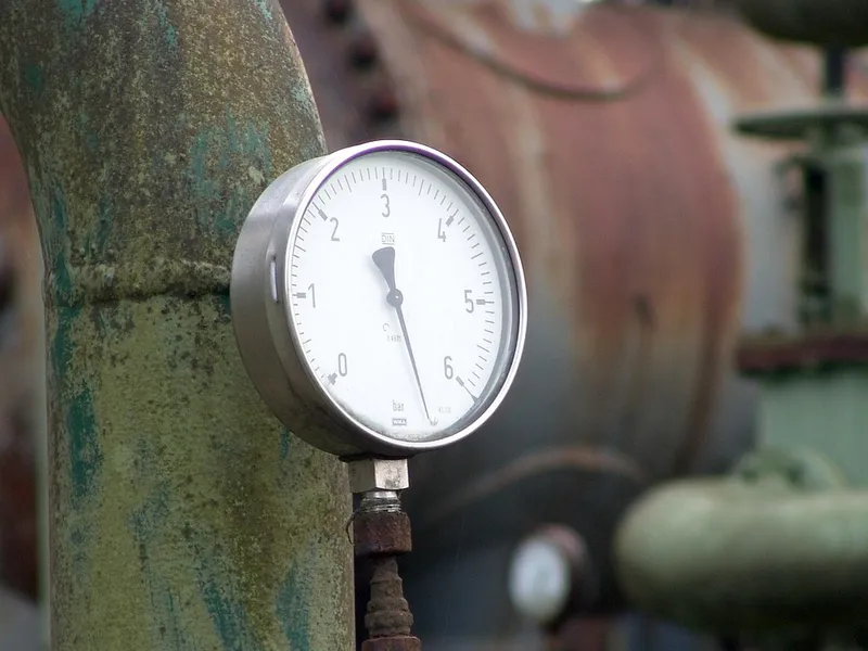 Pressure gauge mounted on an industrial pipe
