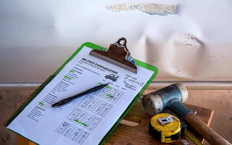 close-up of a written repair cost estimate and quotation paperwork for vehicle damage