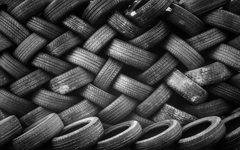 A stack of black racing tyres