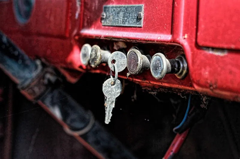 Vintage car dashboard with a key in a switch panel