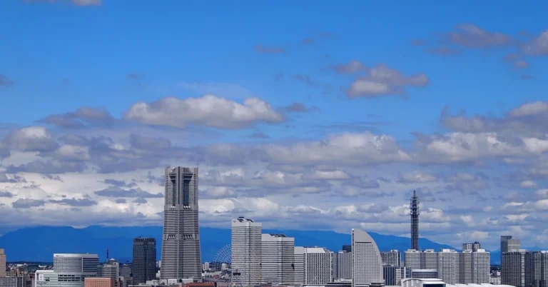 Yokohama waterfront skyline with Landmark Tower under a blue sky