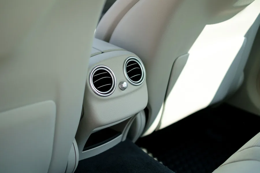 Close-up of car air conditioning vents on the dashboard