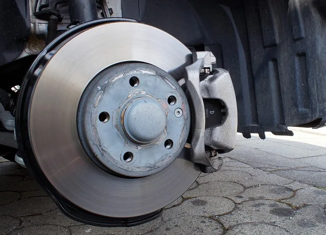 Close-up of a car brake caliper and disc