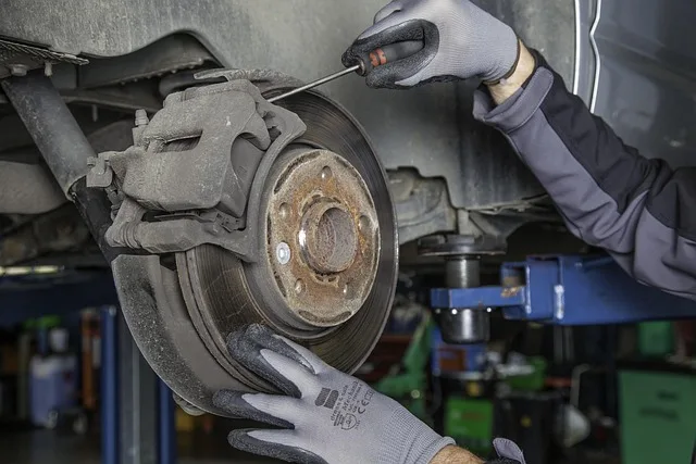 Car brake disc being repaired in an auto shop