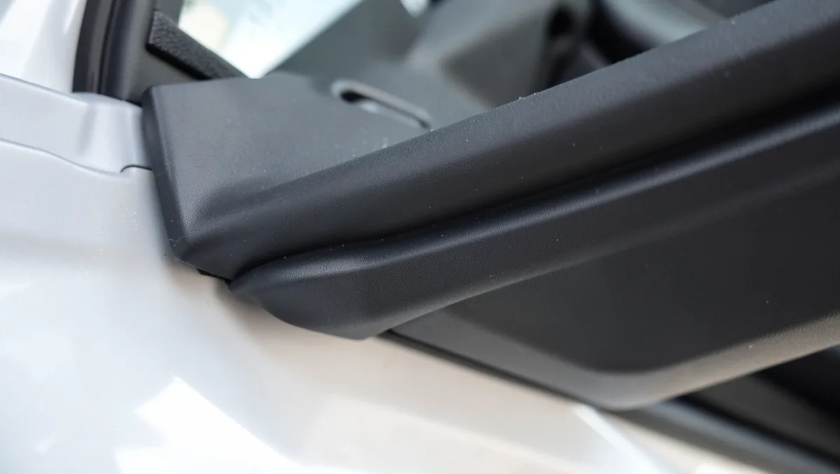 New black rubber weatherstrip door seal installed around a car door frame