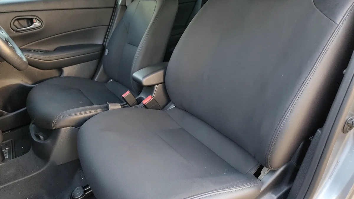 Seat cover fitted over a car seat to protect the upholstery
