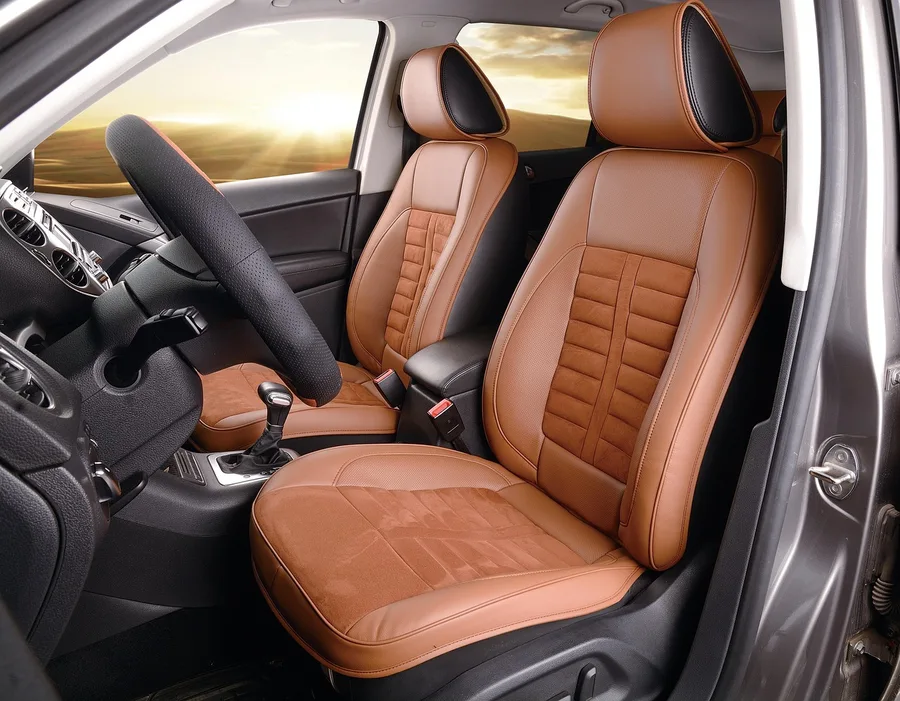 Tan leather car seats and dashboard interior of an SUV