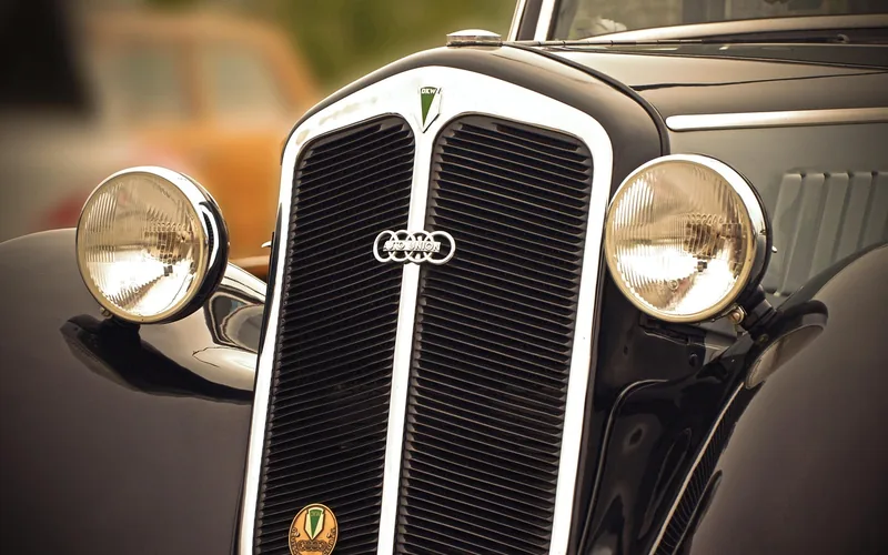 Auto Union four-ring badge on the radiator grille of a vintage DKW car Auto Union four-ring badge on the radiator grille of a vintage DKW car
