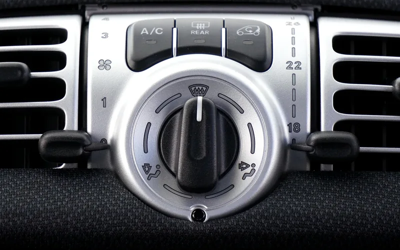 Car dashboard air vents circulating cool air to fight interior heat buildup