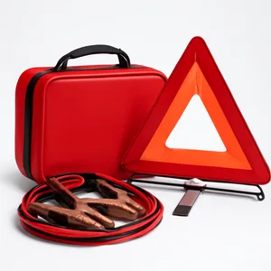 Car roadside emergency kit with jumper cables and warning triangle for low-fuel breakdowns