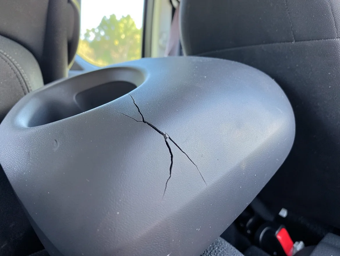 Child car seat with a cracked plastic shell after a car accident