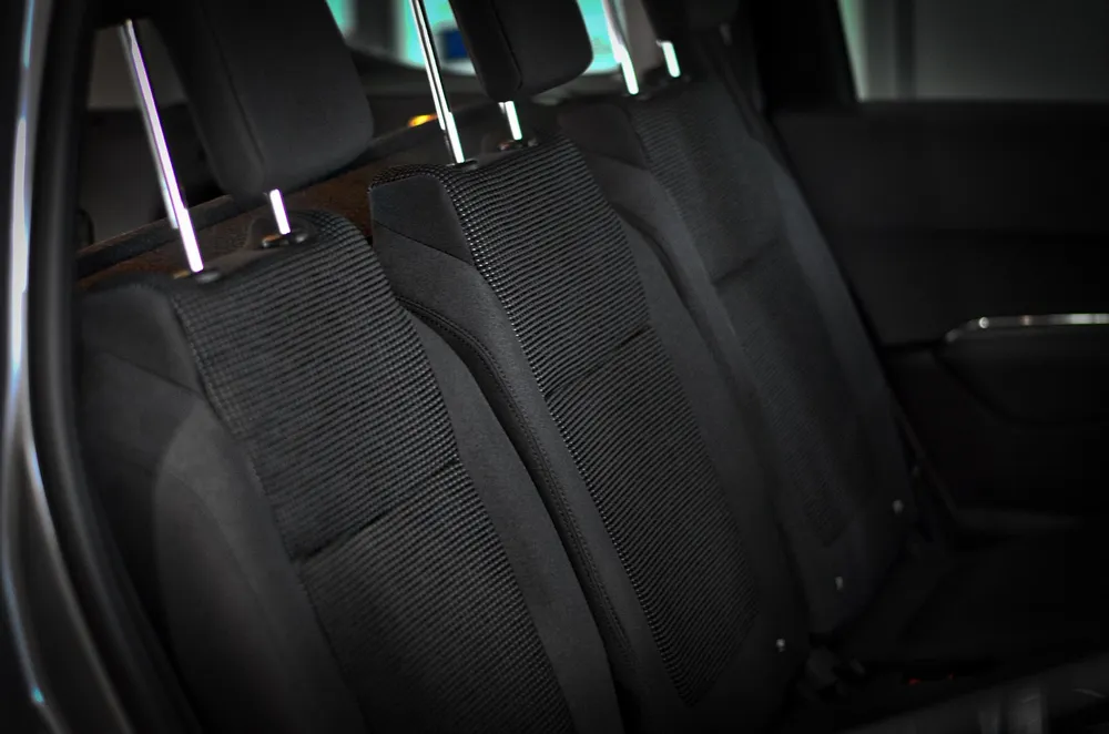 Black fabric rear seats with headrests inside a car