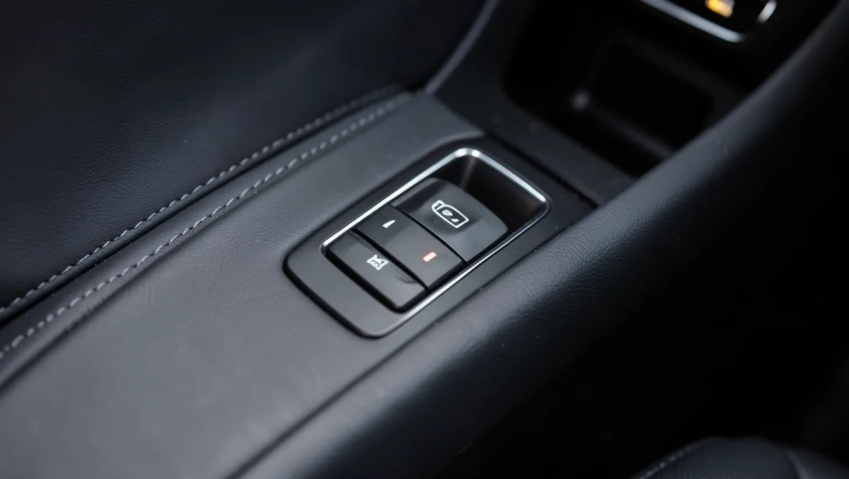 Electronic parking brake button on a car center console