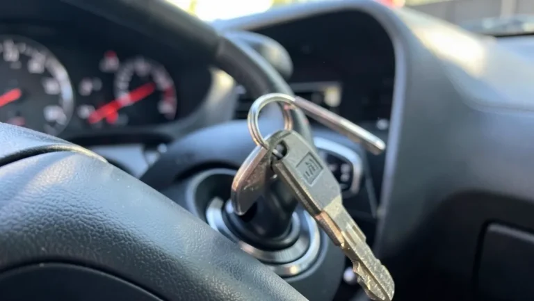 Car ignition key with keyring inserted into the ignition cylinder