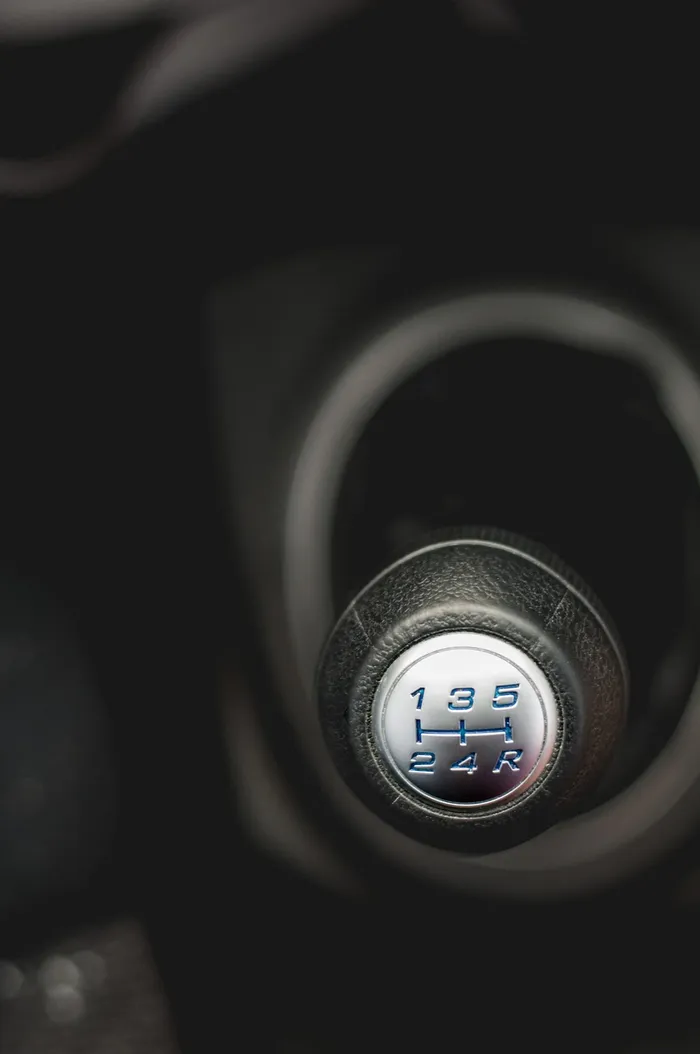 Manual shift knob with a five-speed gear pattern on top