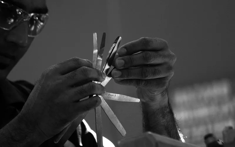 Mechanic hands performing routine engine maintenance and inspection Mechanic hands performing routine engine maintenance and inspection