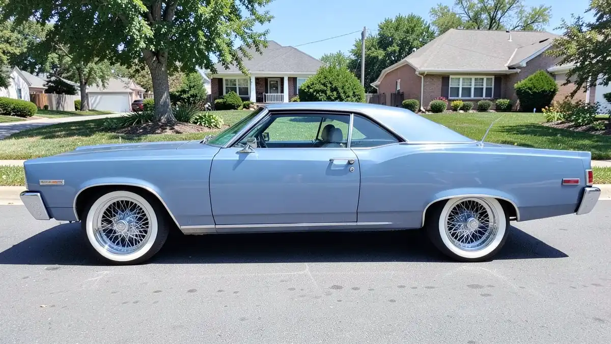 Classic car fitted with chrome wire spoke wheels and whitewall tires