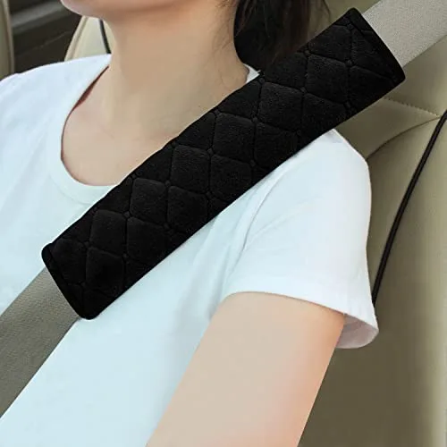 Amooca quilted black seat belt shoulder pad installed over a car seatbelt