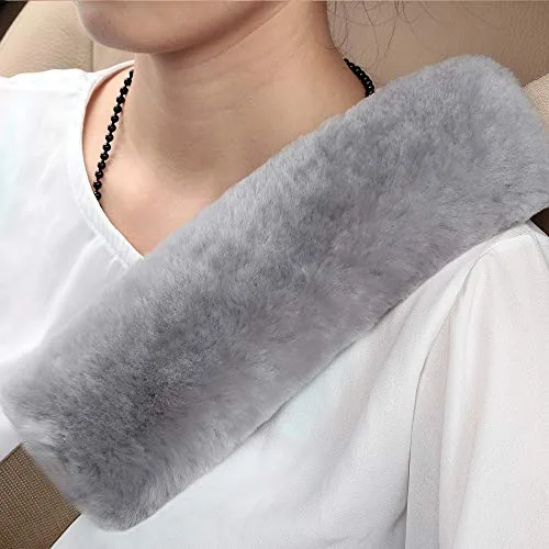 OGLAND genuine sheepskin seat belt pad in misty gray on a car seatbelt