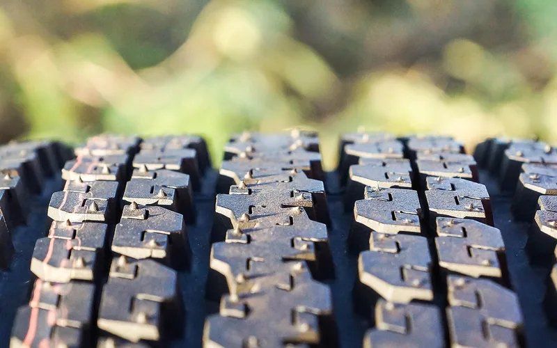 Close-up of a studded winter tire tread