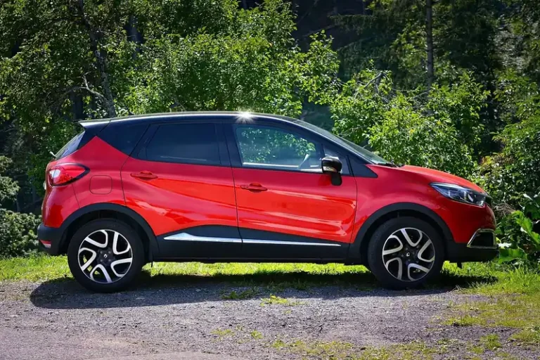 Side view of a crossover SUV showing black plastic wheel arch cladding and lower body trim