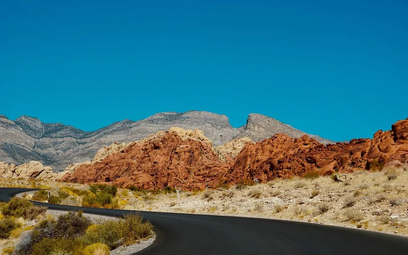 Winding road through a red rock desert landscape