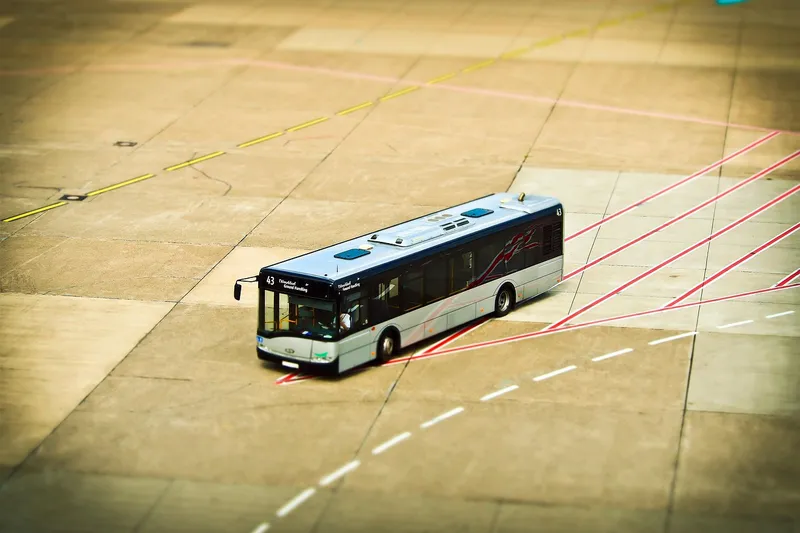 Bus driving across an airport apron