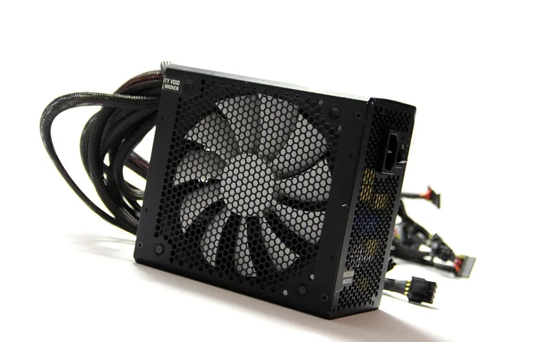 ATX computer power supply with cooling fan repurposed to power a car stereo at home