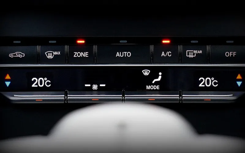 Automatic climate control panel with A/C and AUTO buttons