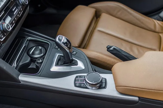 Automatic gear shifter with a manual and sport mode toggle switch in a car console
