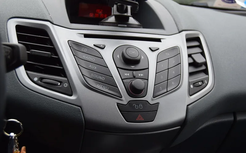 Car dashboard radio controls and command buttons on a modern vehicle Car dashboard radio controls and command buttons on a modern vehicle
