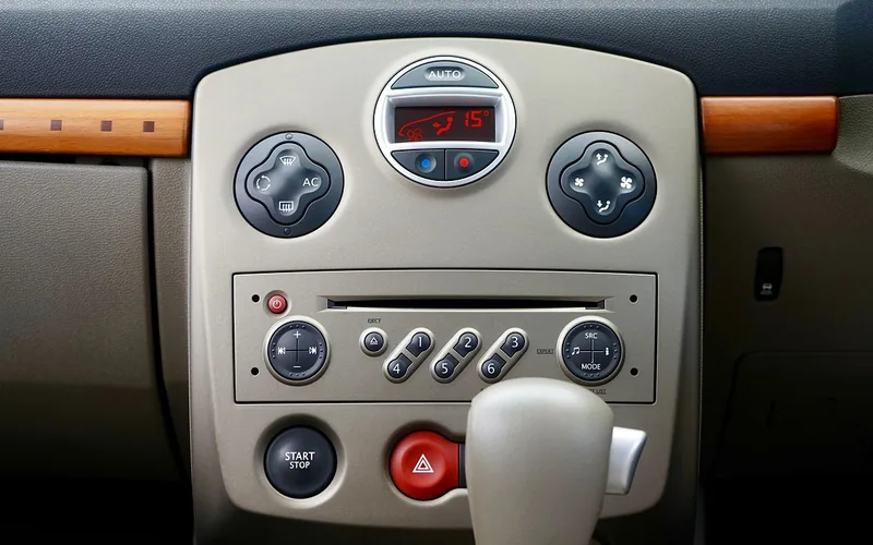 Car stereo dashboard control panel with tuner, scan, and volume knobs Car stereo dashboard control panel with tuner, scan, and volume knobs