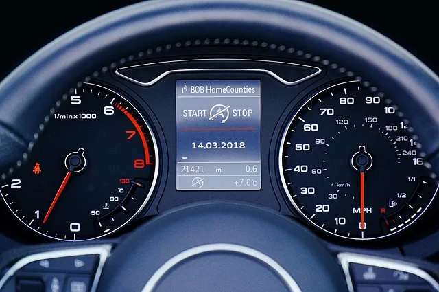 Car dashboard temperature gauge showing engine running in the normal range