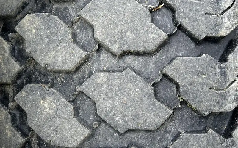 Close-up of a worn tire tread pattern