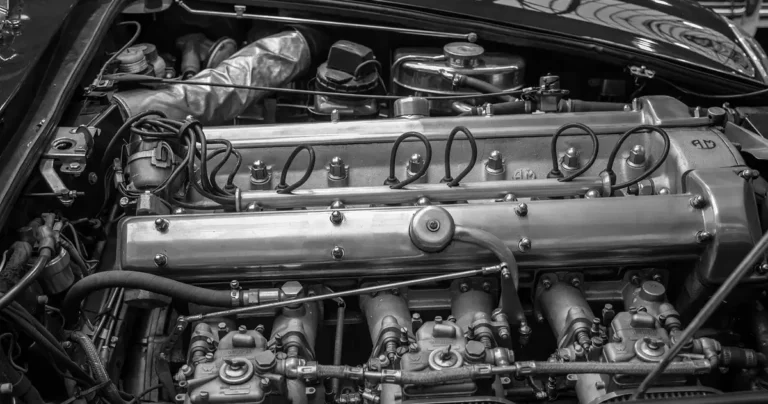 Engine bay of a classic car with the hood open