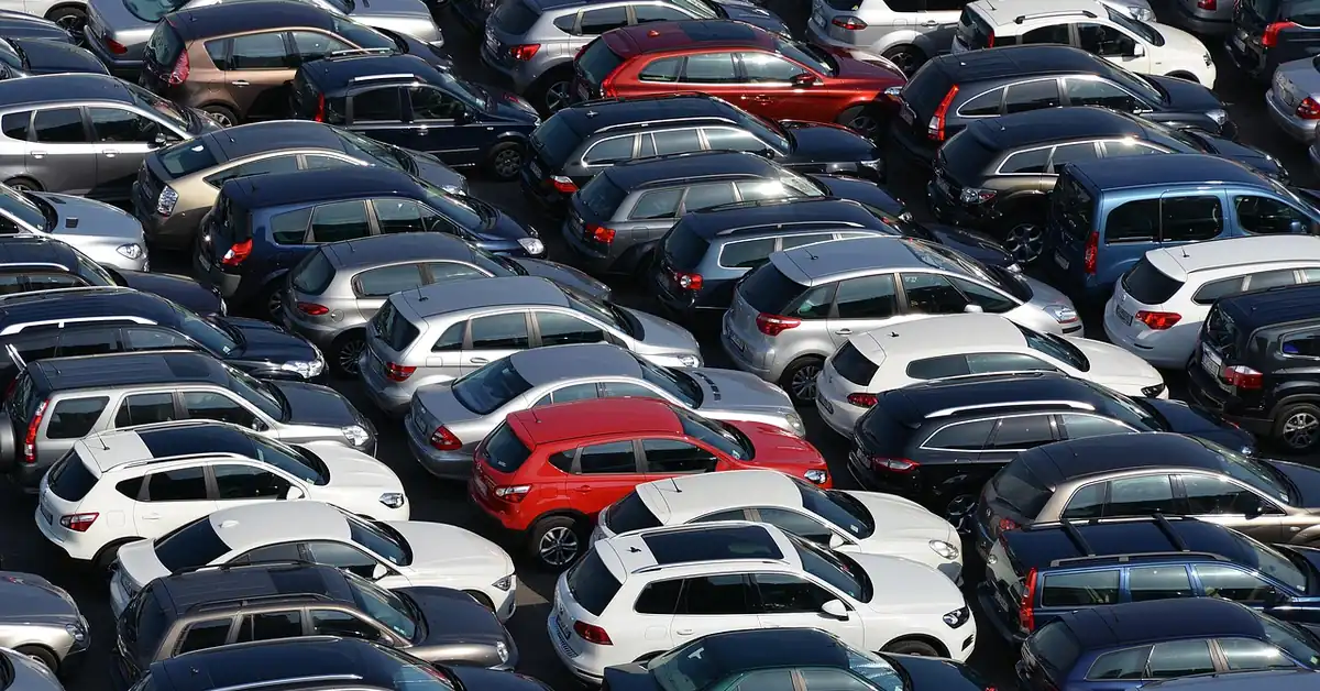 Aerial view of rows of parked cars in a crowded parking lot