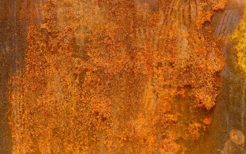 Heavy orange rust texture covering a metal surface