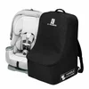 J.L. Childress padded backpack car seat travel bag next to a child car seat