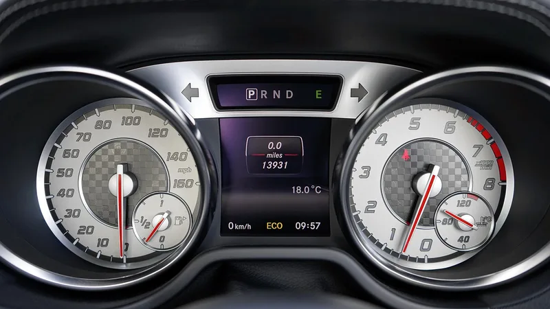 Car instrument cluster showing a mileage readout