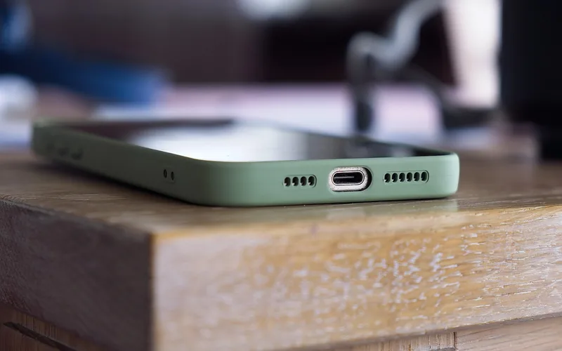 Close-up of a phone USB-C port, the connector used for wired Android Auto