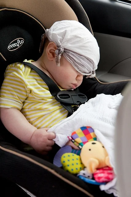 A correctly reassembled infant car seat with harness properly secured
