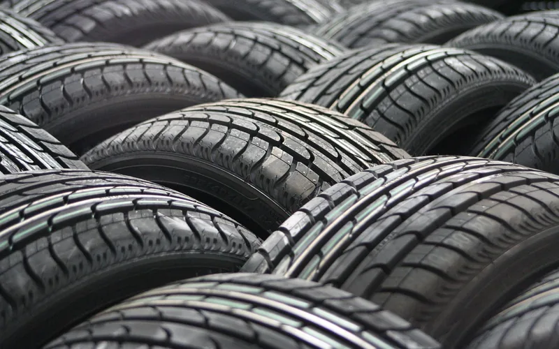 Rows of new car tires showing the tread pattern