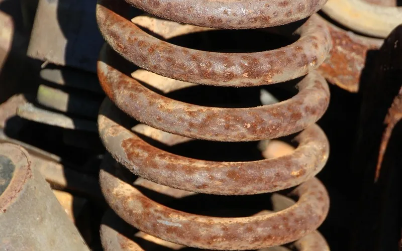 Rusted steel coil spring close up