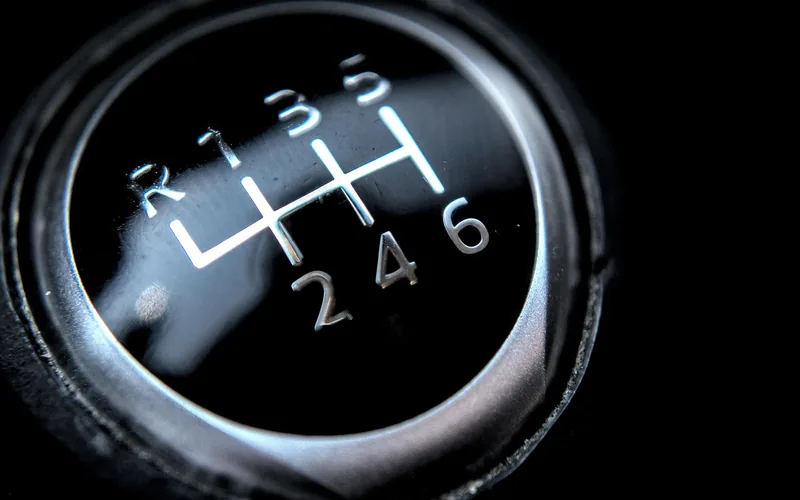 Close-up of a six-speed manual transmission gear stick while driving Close-up of a six-speed manual transmission gear stick while driving