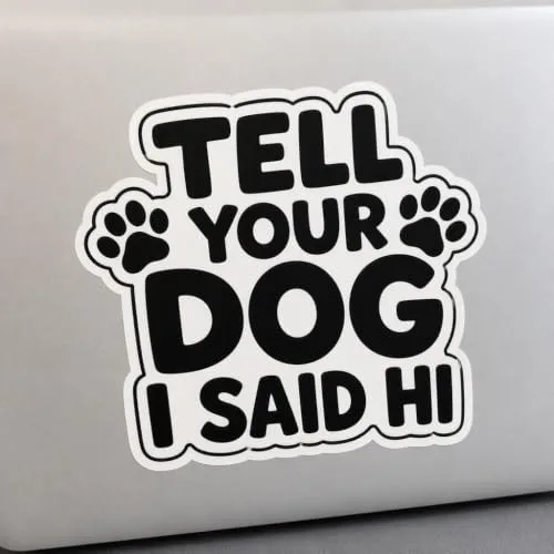Tell Your Dog I Said Hi black vinyl decal sticker with paw prints applied to a laptop lid