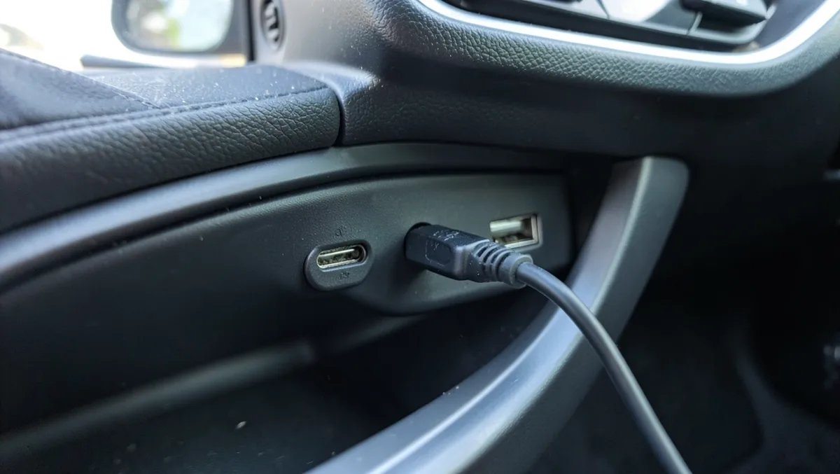 USB cable plugged into a car USB port as an alternative to Bluetooth