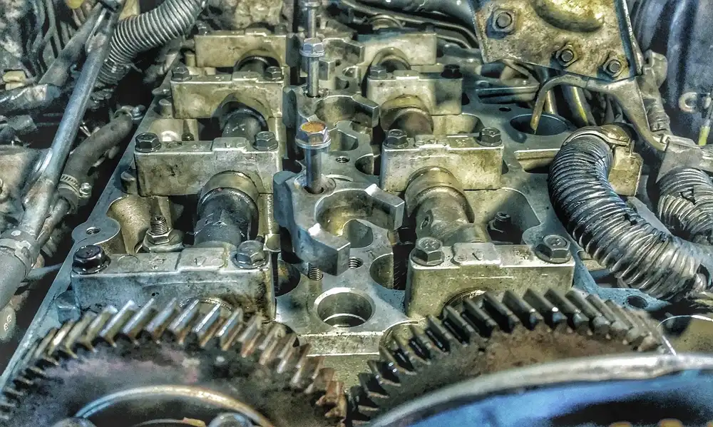 Camshafts, bearing caps and drive gears on an opened engine